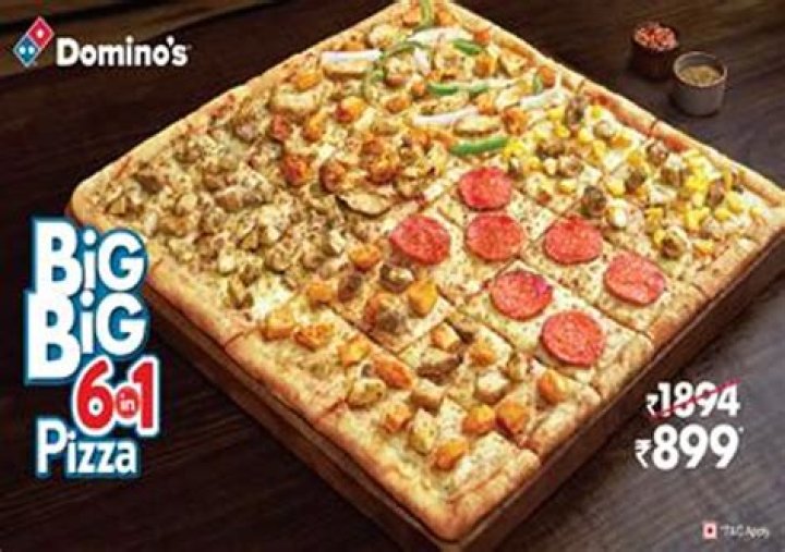 Enjoying Delicious Pizza at Domino's - SarkariResult
